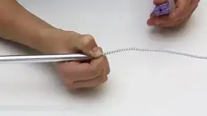 Hold the shock cord and tension with the help of a clothes pin.