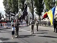 Yulia Mykytenko leads the "Female veterans movement" column at the unofficial ("volunteer") military parade for the Independence Day of Ukraine on August 24, 2021 (in the middle).