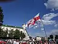Protesters in Baranavichy holding a flag with the Pahonia, 16 August 2020