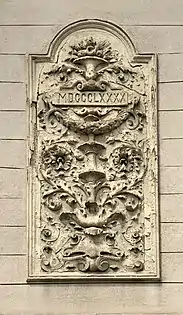 Arabesque with foliage spirals and a rectangular cartouche with the year when the house was built, on a corner of Strada General H.M. Berthelot no. 52, Bucharest, unknown architect, 1890