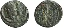 A coin depicting a queen and a king. The queen's portrait is in the front.