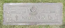 Bronze plaque inscribed with the name Dawson, and smaller name plates for Earl P. and Madeline