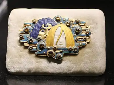 Appearances belt buckle, of gold, ivory, topaz, glazes, and cabachons, or rounded gemstones. designed by Eugène Grasset (c. 1900) (Musée d'Orsay)
