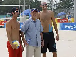 President George W. Bush poses with Todd Rogers and Phil Dalhausser during a practice session in Beijing.
