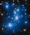Abell 2744 intracluster light artificially colored in blue. This light come from galaxies that were torn apart long ago by the cluster's gravitational forces.