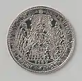 1587 medal commemorating Elizabeth I holding scepter and orb, trampling a hydra, wth Robert Dudley, 1st Earl of Leicester, the Governor-General of the United Provinces, to her right. Five cherubs hold the arms of the United Provinces