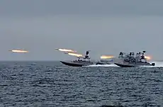 Rocket-armed Speedboats firing rockets on the Nimitz replica.
