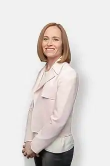 A photograph of Dr. Jeannie Callum with hands clasped, facing the camera