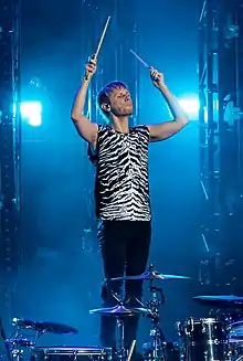 Howard performing with Muse in 2018