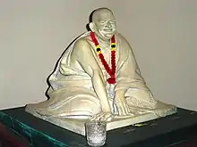 Neem Karoli Baba sculpture in Ram Dass library