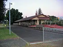 Station platform with wooden building