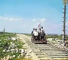 Handcar riding along the Murmansk railroad, on the shore of Lake Onega. (circa 1916)