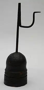 Rushlight with (pest) holes in base