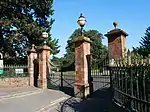 Western entrance gate, listed as Grade II with the lodge