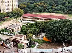 White, two-storied neo-gothic building with leading dual staircase
