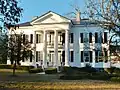 The Pillars is a Greek Revival Antebellum plantation home that was built in 1857 by Archibald Tyson, a cotton planter from North Carolina.