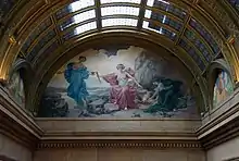 The Sacred Flame mural under a skylight