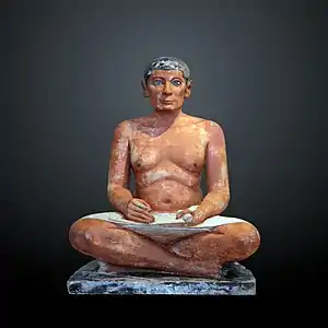 The Seated Scribe; 2613–2494 BC; painted limestone and inlaid quartz; height: 53.7 cm; Louvre
