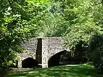 Packhorse bridge 75 m south east of The Old Vicarage